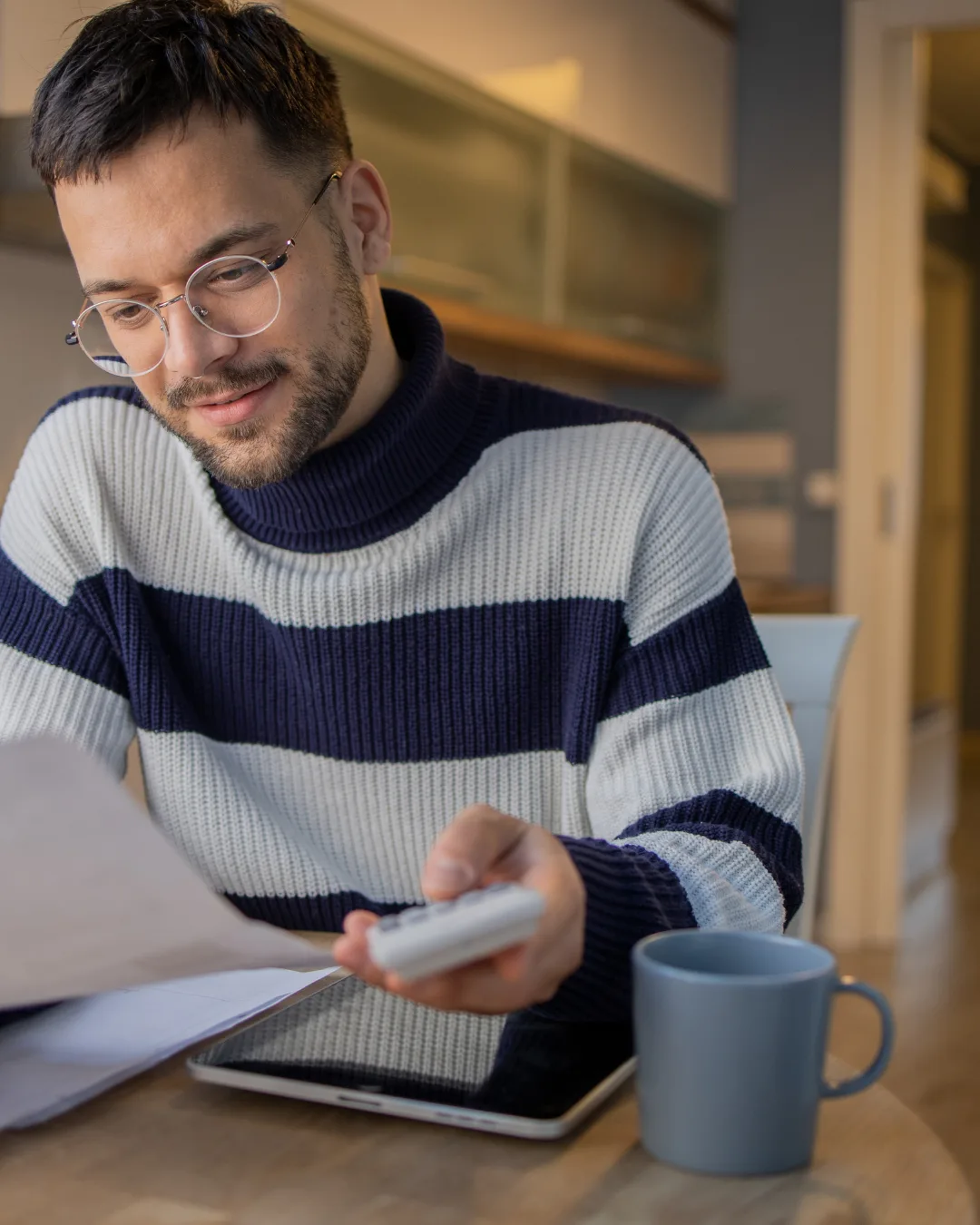 A person reviewing tax correspondence and documents from home